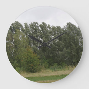 Lijn van hellende bomen landschap wandklok