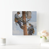 lijnteam werkt met poolklok vierkante klok (Huis)