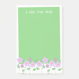 Lila bloemen en groene post-it notities post-it® notes