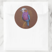 Lila rammelvogel, n.t. ronde sticker (Tas)