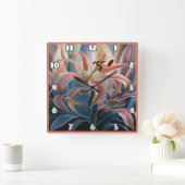 Lily bloeit tussen kleurrijke bladeren bij zonsond vierkante klok (Huis)