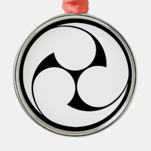 Links drie komma metalen ornament