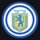 Lion Judah Emblem Ariel Hebrew Sticker<br><div class="desc">Ronde sticker met een afbeelding van een blauwe en gele lion van het Judah-embleem met Ariel in het Hebreeuws bovenaan, en brede dubbele blauwe randen in lichtblauw getrimd op wit. Zie overeenkomend confetti-, label- en verpakkingspapier. Zie het gehele collectie Hanukkah Sticker onder de categorie CARDS & STICKERS in de sectie...</div>