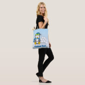 Little penguin sitting with snowballs tote bag (Op model)