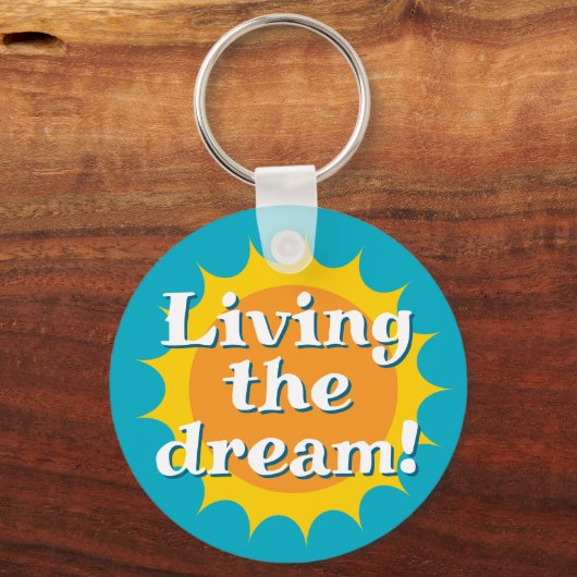 Living the dream keychain with sunny logo (Voorkant)