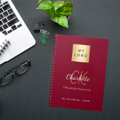 Logo bordeauxrood gouden monogram bedrijf notitieboek