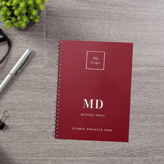 Logo rood wit monogram initialen bedrijf notitieboek