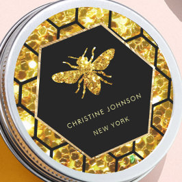 logo van zeshoek bij zwart ronde sticker