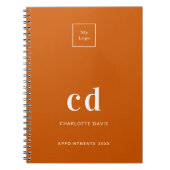 Logo verbrande oranje monogram beginletters bedrij notitieboek (Voorkant)