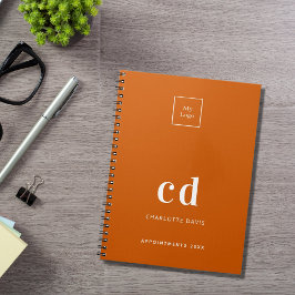 Logo verbrande oranje monogram initiaal bedrijf notitieboek