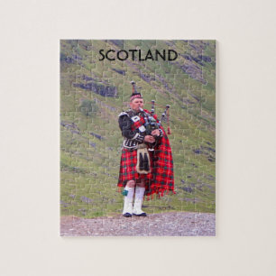 Lone Scottish bagpiper, Highlands, Schotland Legpuzzel