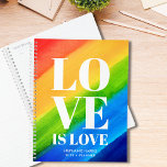 Love Gay Pride Rainbow Planner<br><div class="desc">Deze Gay Pride Planner is versierd met LOVE IS LOVE in vetgedrukte witte typografie op een waterverf regenboogachtergrond van rood,  sinaasappel,  geel,  groen en blauw. Gemakkelijk aan te passen met jouw naam en jaar. Originele Waterverf © Michele Davies.</div>