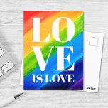 Love Rainbow Pride Briefkaart<br><div class="desc">Dit Gay Pride Briefkaart is versierd met LOVE IS LOVE in vetgedrukte witte letters op een waterverf regenboogachtergrond van rood,  oranje,  geel,  groen,  blauw en paars. Oorspronkelijke Waterverf © Michele Davies.</div>