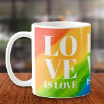 Love Rainbow Pride Koffiemok<br><div class="desc">Deze Gay Pride Mok is versierd met LOVE IS LOVE in vetgedrukte witte typografie op een waterverf regenboogachtergrond van rood,  oranje,  geel,  groen,  blauw en paars. Oorspronkelijke Waterverf © Michele Davies.</div>