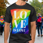 Love Rainbow Pride T-shirt<br><div class="desc">Dit Pride T-shirt is versierd met LOVE IS LOVE in vetgedrukte witte letters op een waterverf regenboogachtergrond van rood, oranje, geel, groen, blauw en paars. Oorspronkelijke Waterverf © Michele Davies.</div>