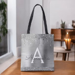 Luxe Zilveren Glitter Sparkle Elegant Monogram Tote Bag<br><div class="desc">Luxe Silver Faux Sparkle en Dripping Glitter Metallic RVS Folie Elegante Monogram Boekentas. Deze boekentas kan worden aangepast om uw initiaal en voornaam op te nemen en wordt gegeven als een geschenk voor Kerstmis,  Sweet 16,  18th,  21st,  30th,  40th,  50th,  of 60th Birthday,  Vrijgezellenfeest of een bruiloft.</div>