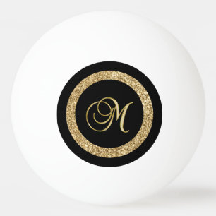 M gouden monogram op zwart pingpongbal