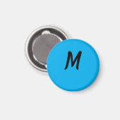 M op een blauwe magneet (Voorkant / Achterkant)
