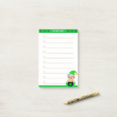 Maak een lijst en een schattig groen elf met goude post-it® notes (Op bureau)