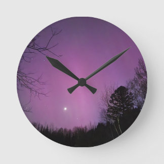 Maanverlichte auroramuurklok ronde klok