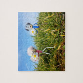 Madeliefjes plukkende fubby's.     legpuzzel (Verticaal)