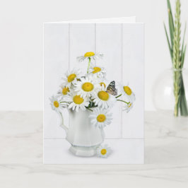 Madeliefjesboeket met vlinder op gewit hout kaart