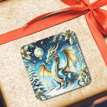 Magical Dragon Christmas beroemd gemaakt door Holl Vierkante Sticker<br><div class="desc">Dit AI-kunstwerk is voorzien van een kerstkaart met een magische draak die sierlijk op een besneeuwde heuvel is neergestreken, omringd door takjes hulst en delicate sneeuwvlokken die glinsteren in het winterlicht. De schubben van de draak glinsteren in ijzige blues en feestelijke greens en mengen zich perfect met het vakantielandschap, terwijl...</div>