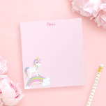 Magische regenboog Unicorn roze gepersonaliseerd Notitieblok<br><div class="desc">Schattige eenhoorn notitieblok met sterretjes en een regenboog op een lichtroze achtergrond. Personaliseer met haar naam om een leuk cadeau te maken voor een meisje!</div>