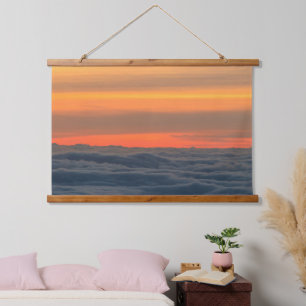 Magische zonsondergang boven de wolken hangend wandkleed