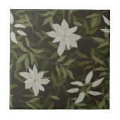 Magnolia en groen blad op zwart tegeltje (Voorkant)