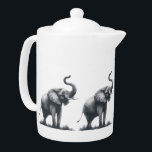 Majestueuze olifant met verhoogde stam theepot<br><div class="desc">Vier de schoonheid en kracht van natuur met dit charmante ontwerp met een majestueuze olifant met zijn stam hoog verhoogd - een universeel symbool van kracht, wijsheid en geluk. Of je nu van olifanten houdt, van wildlife art houdt of gewoon een positieve sfeer aan je ruimte wilt toevoegen, dit opbeurende...</div>