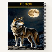 Majestueuze wolf huilt bij het lichtgevende maanli notitieboek (Achterkant)