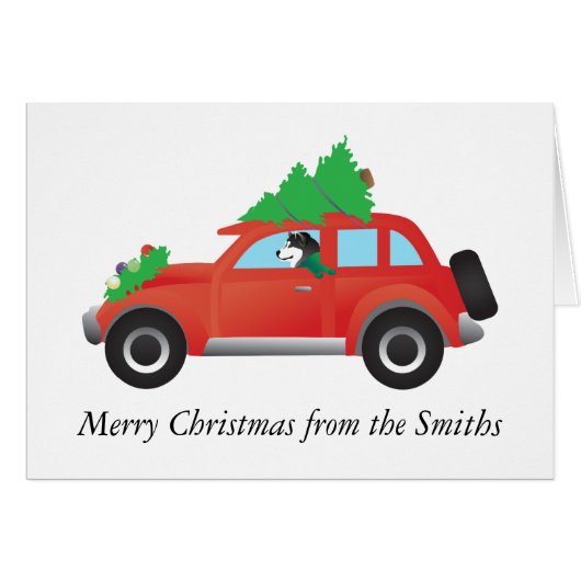 Malamute Driving een kerstboom met een auto op de  (Voorkant Horizontaal)