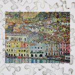 Malcesine on Lake Garda By Gustav Klimt Legpuzzel<br><div class="desc">Malcesine on Lake Garda (1913) by Gustav Klimt is a vintage Victorian Era Art Nouveau fine art symbolism painting. A beautiful view of the Italian city of Malcesine with buildings and houses on the edge of the harbor. The homes and boats cast a reflection in the calm water. You can...</div>