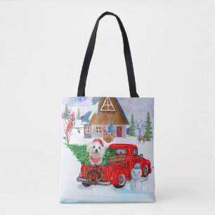 Maltese hond in kerstcadeauwagen tote bag
