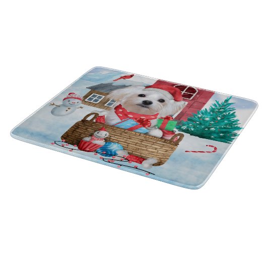 Maltese hond op sneeuwkerstmis snijplank (Hoek)
