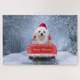 Maltezer hond in de sneeuw zittend in Kersttruck Legpuzzel