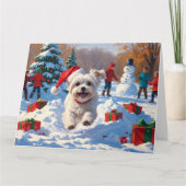 Maltezer hond rent in de sneeuw met kerstmuts kaart (Voorkant)