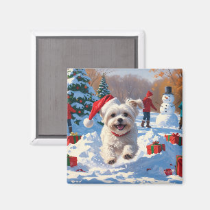 Maltezer hond rent in de sneeuw met kerstmuts magneet