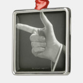 Man aanwijzen metalen ornament (Links)