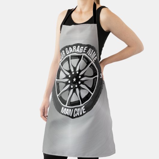 Man bedekt uw bandenwiel voor kledingstuk schort (Insitu)