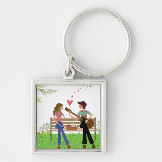 Man dat gitaar speelt met een vrouw naast haar sleutelhanger (Voorkant)