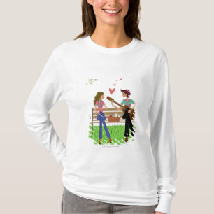 Man dat gitaar speelt met een vrouw naast haar t-shirt