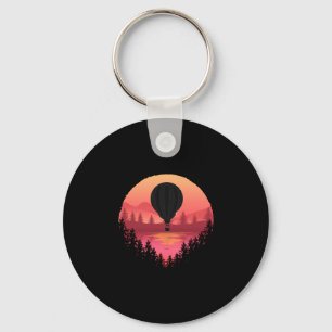 Man die met hete luchtballon vliegt_ coole prestat sleutelhanger