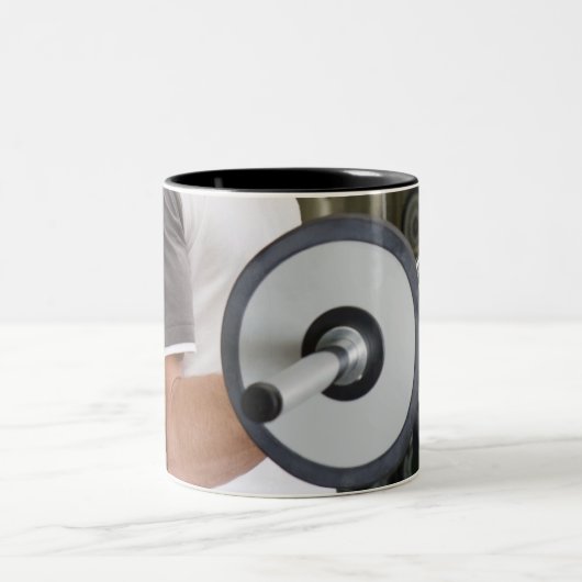 Man hefgewichten in gyroscoop 2 tweekleurige koffiemok (Center)