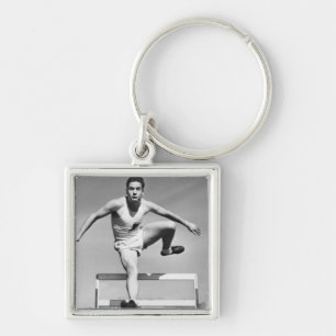 Man Hurdling Sleutelhanger