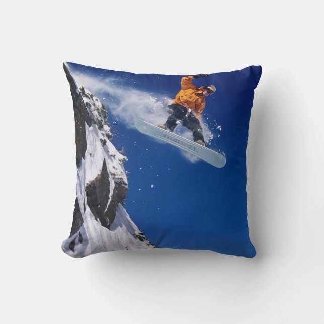 Man op een snowboard springend van een richel kussen (Voorkant)