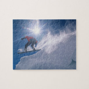 Man springt van een grote cornince af op een snowb legpuzzel