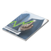 Man waarop het concept "aandelenkoers" is afgebeel notitieblok (Linkerzijde)