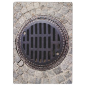 Manhole-afdekking en kasseienweg klembord (Achterkant)